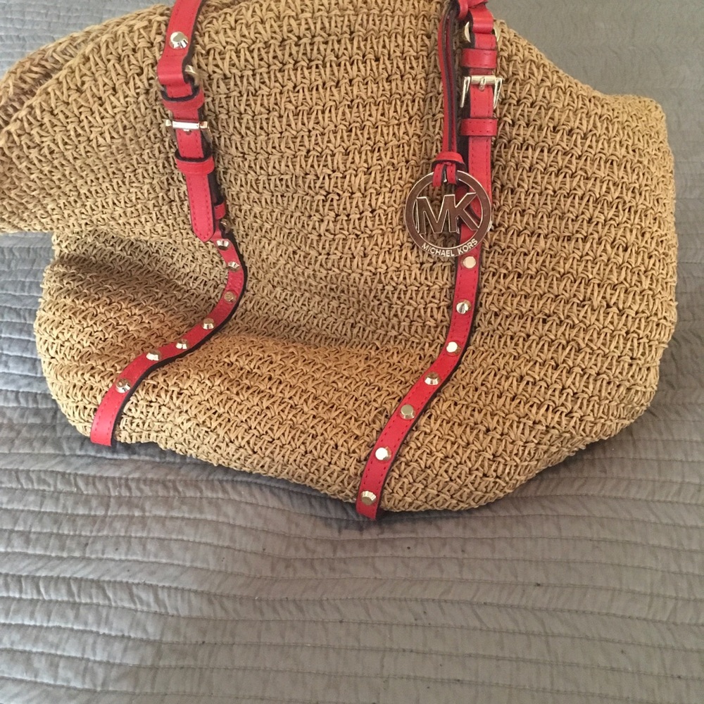 Michael Kors stray with orange leather bag